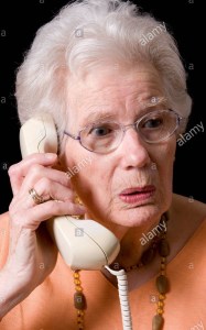 an-old-woman-receiving-bad-news-on-the-phone-uk-B1NGBH